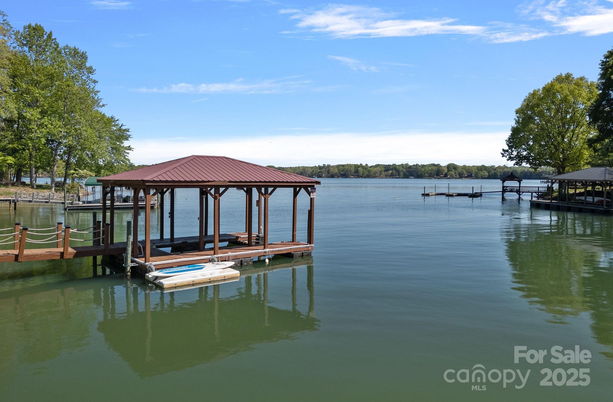4786 Heather Lane Denver, NC 28037 - Photo 3 of 48 a view of a lake with a house in the background