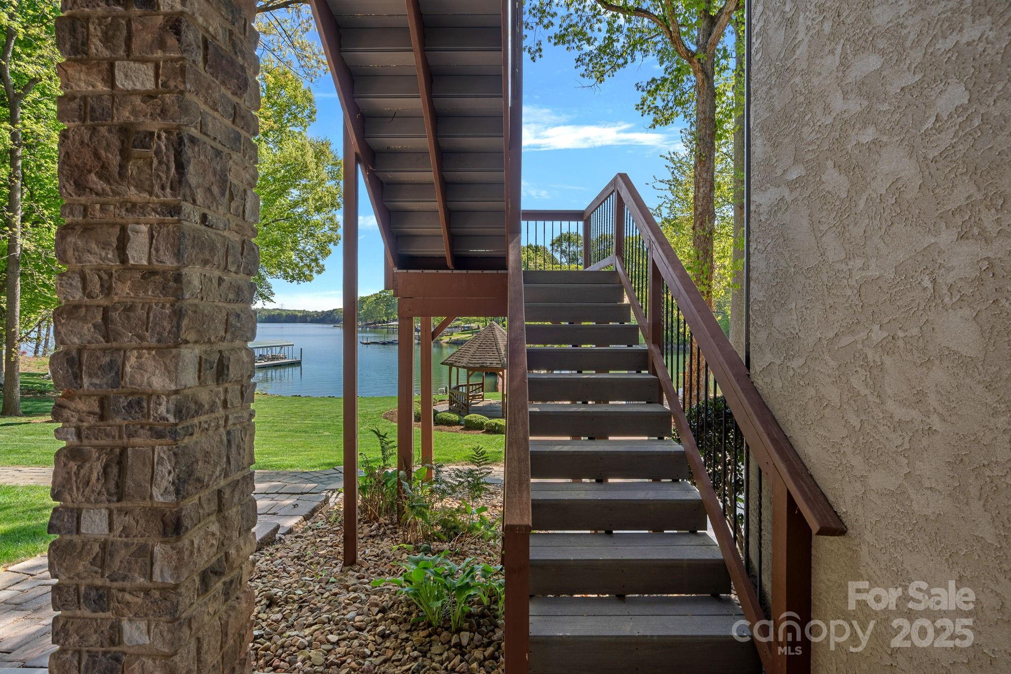 4786 Heather Lane Denver, NC 28037 - Photo 37 of 48 a view of staircase with wooden fence