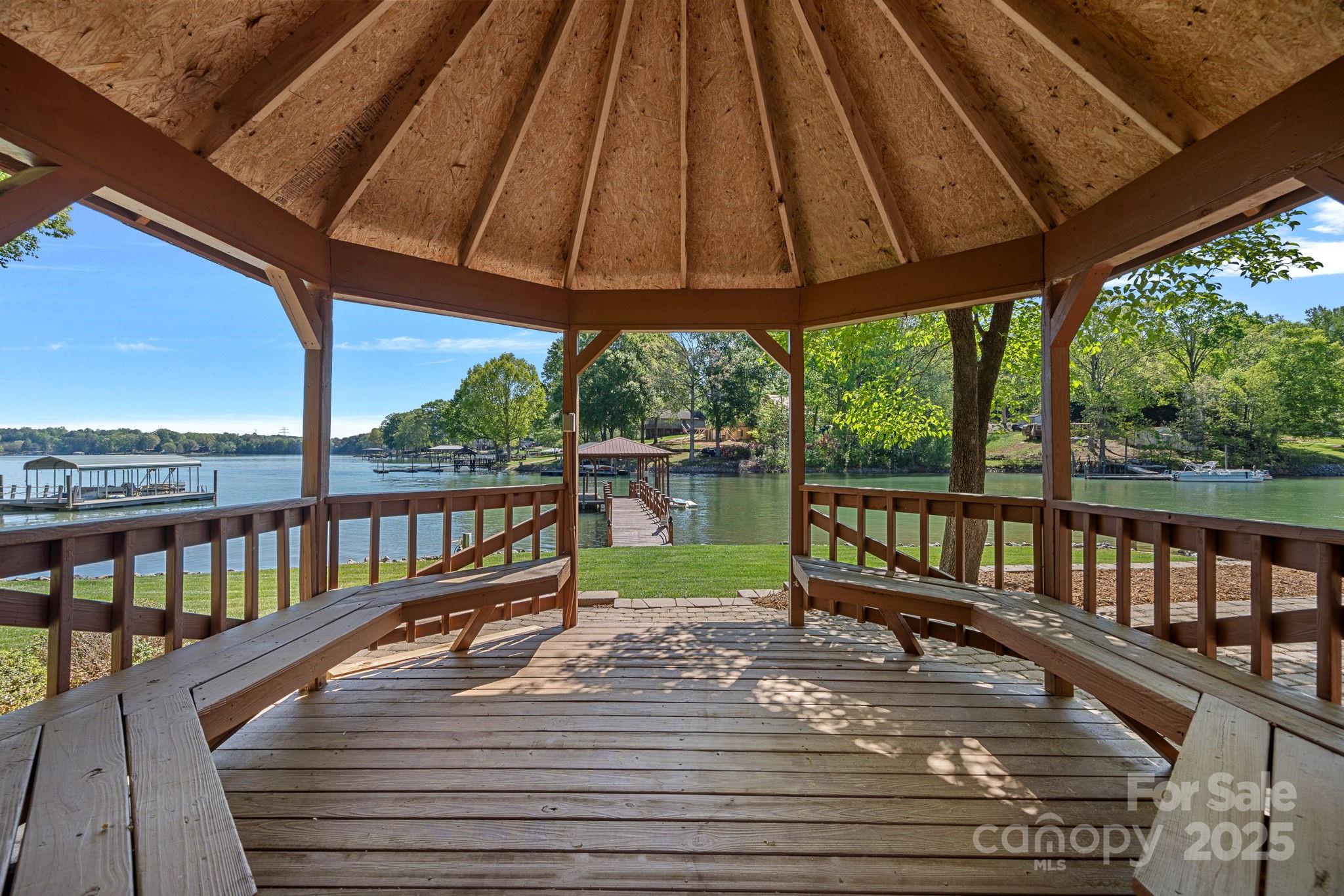 4786 Heather Lane Denver, NC 28037 - Photo 42 of 48 a view of a balcony with wooden floor and outdoor seating