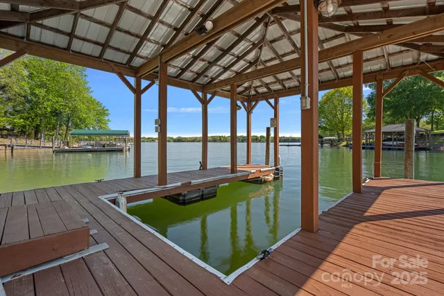 an aerial view of a houses with lake view