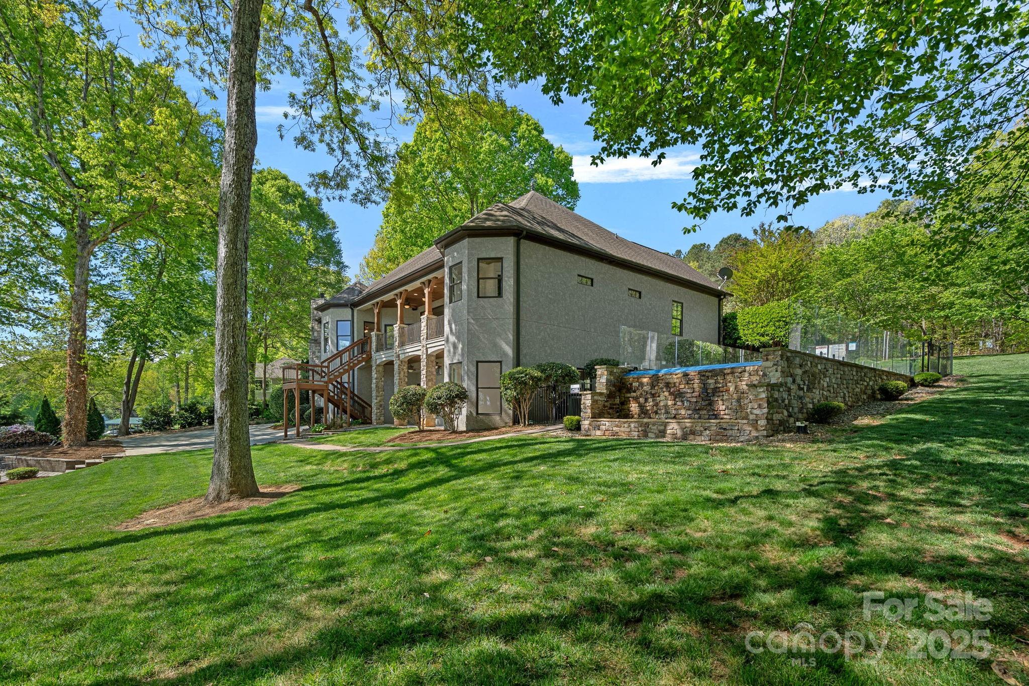 4786 Heather Lane Denver, NC 28037 - Photo 45 of 48 a view of a house with backyard and a tree