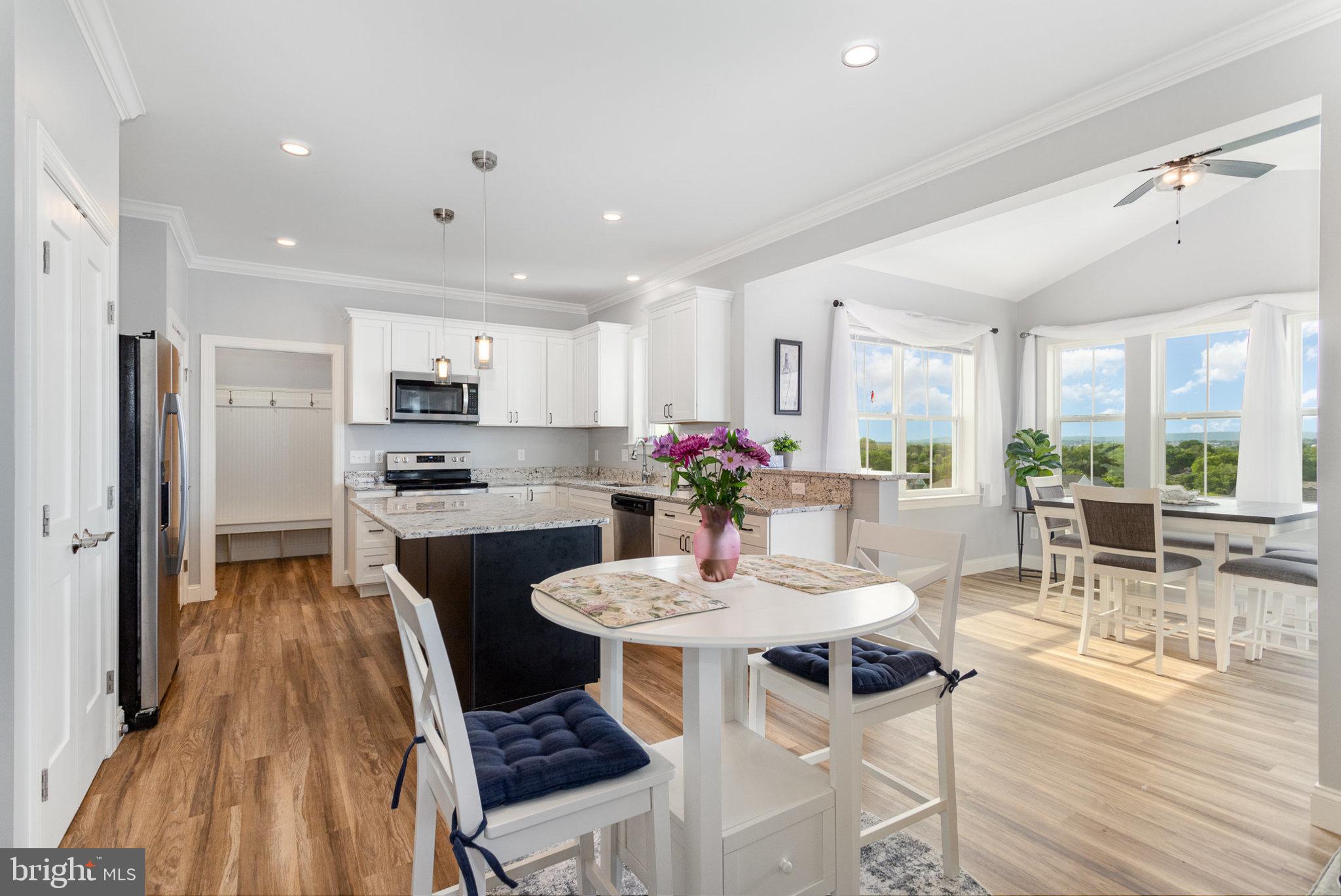 309 Pierson Road Lititz, PA 17543 - Photo 5 of 24 a view of a dining room with furniture and wooden floor