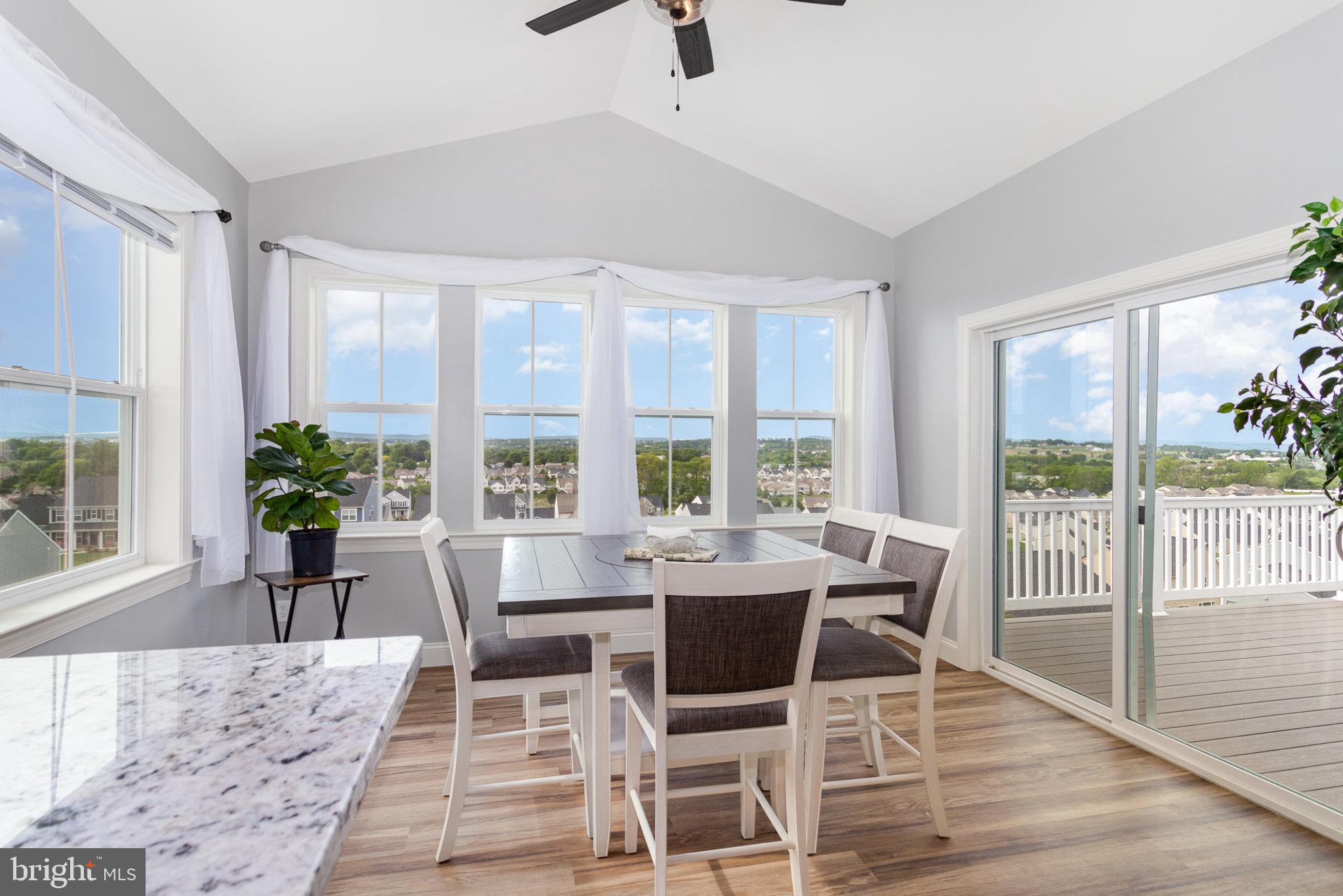 309 Pierson Road Lititz, PA 17543 - Photo 8 of 24 a view of a dining room with furniture window and wooden floor