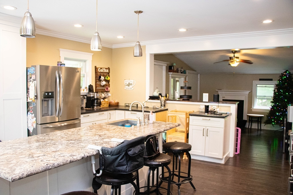 85-87 Slater Street Webster, MA 01570 - Photo 23 of 41 a large kitchen with kitchen island a large counter top space and stainless steel appliances