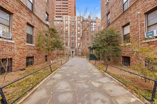 a kitchen with stainless steel appliances granite countertop a stove and a refrigerator