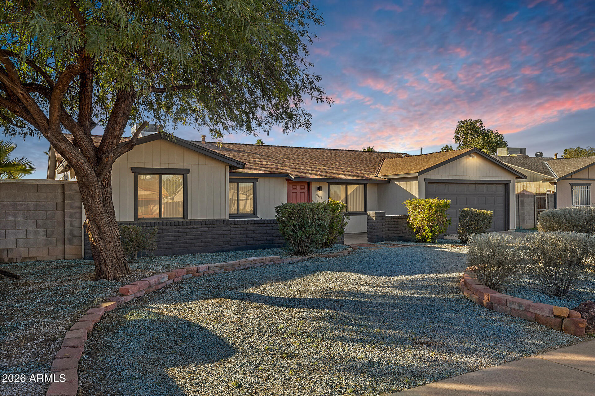 3749 East Pershing Avenue Phoenix, AZ 85032 - Photo 1 of 53 a front view of a house with a yard and garage