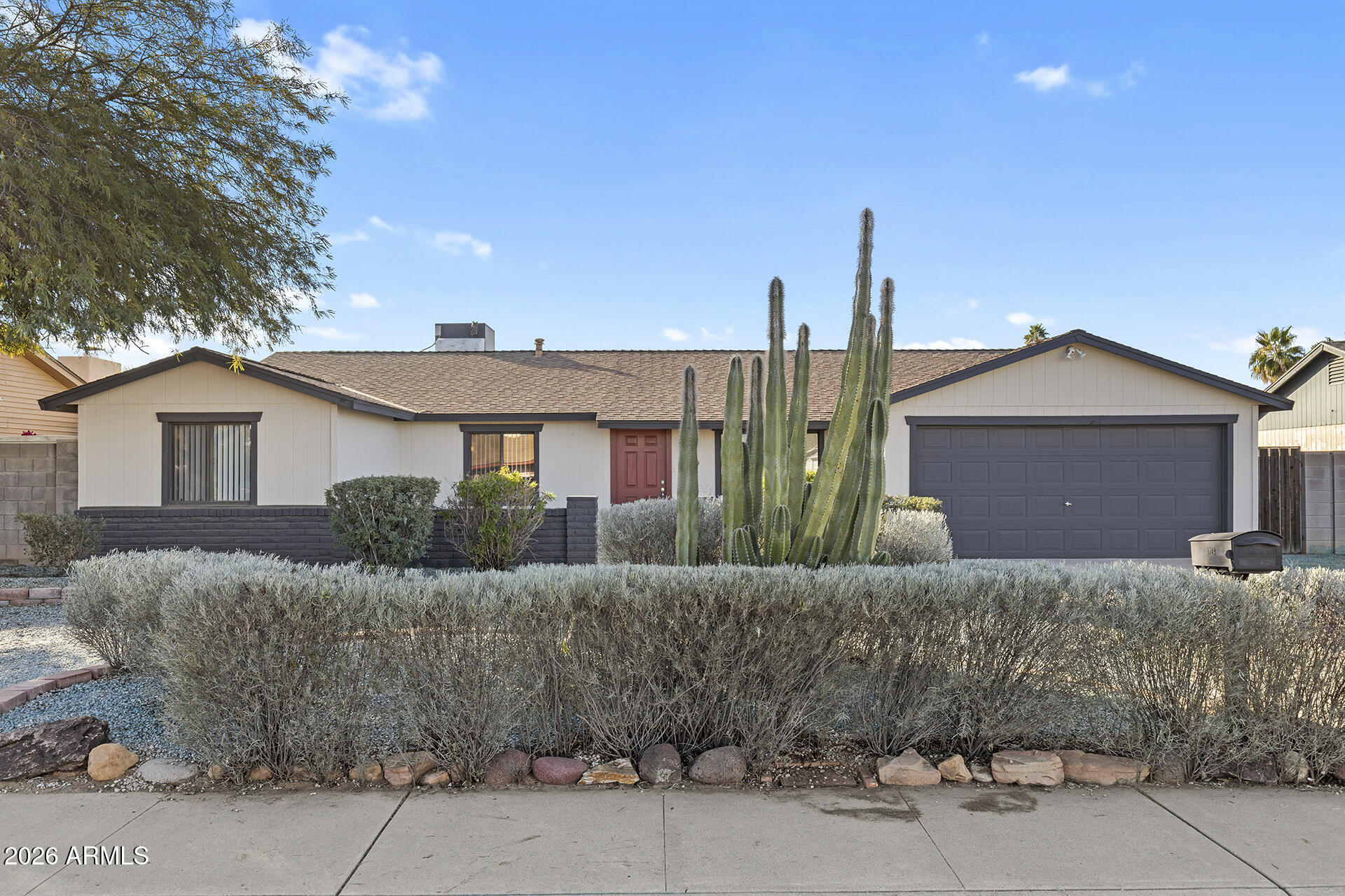 3749 East Pershing Avenue Phoenix, AZ 85032 - Photo 10 of 53 a front view of a house with a yard