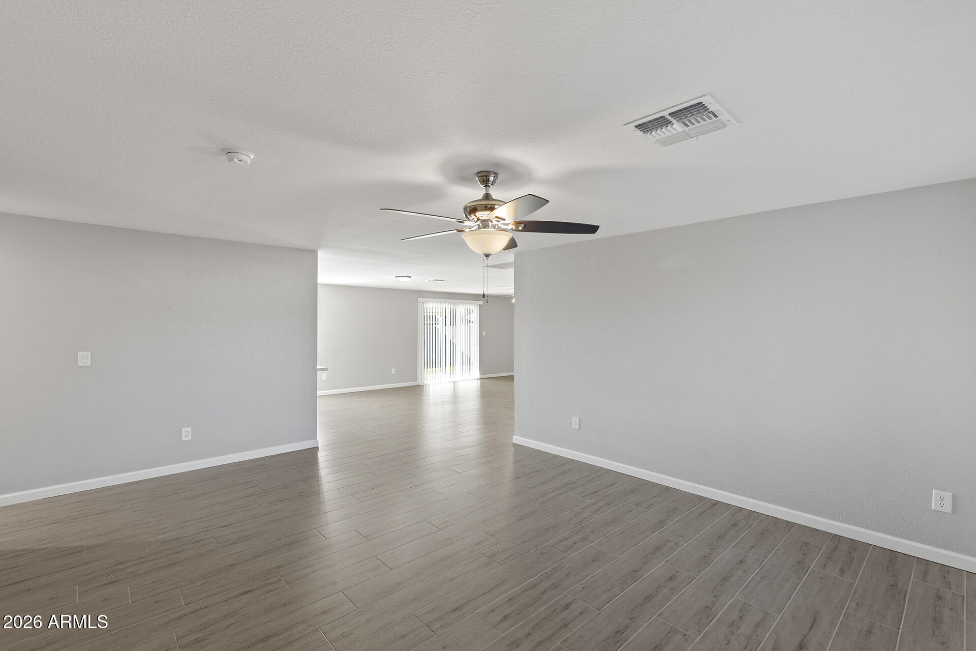 3749 East Pershing Avenue Phoenix, AZ 85032 - Photo 13 of 53 a view of a room with wooden floor