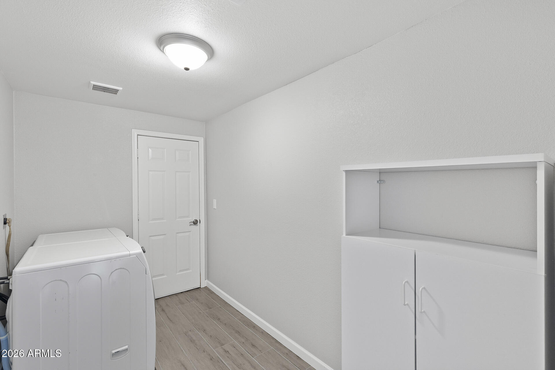 3749 East Pershing Avenue Phoenix, AZ 85032 - Photo 17 of 53 a view of storage and utility room with washer and dryer