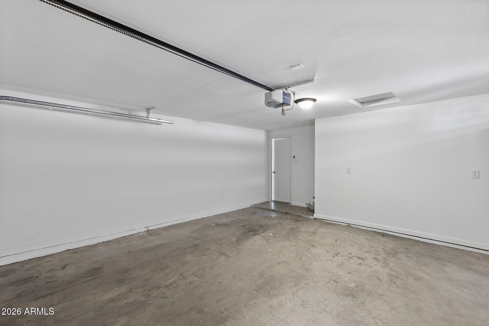 3749 East Pershing Avenue Phoenix, AZ 85032 - Photo 18 of 53 an empty room with a ceiling fan and a window
