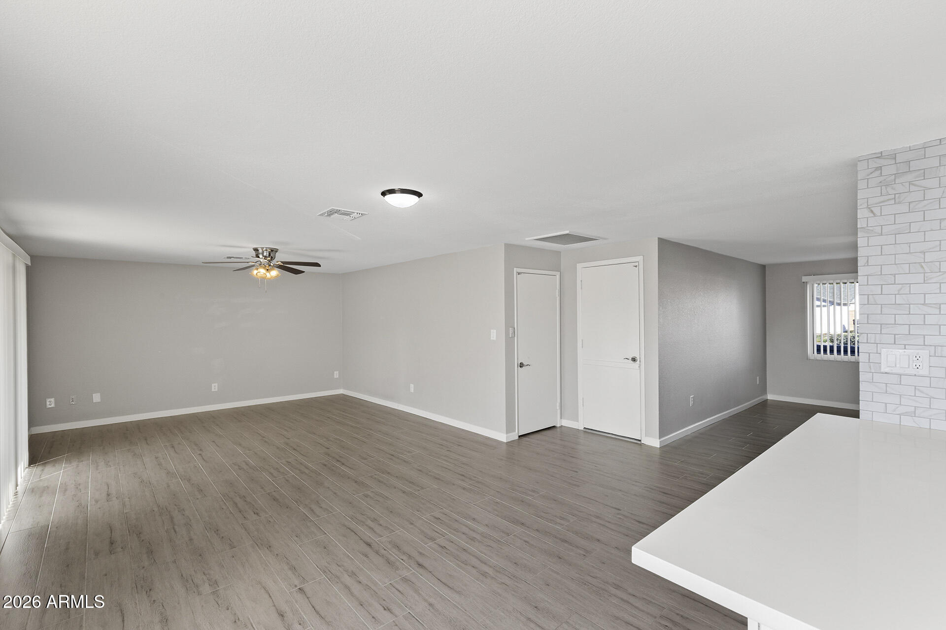 3749 East Pershing Avenue Phoenix, AZ 85032 - Photo 24 of 53 a view of an empty room with wooden floor