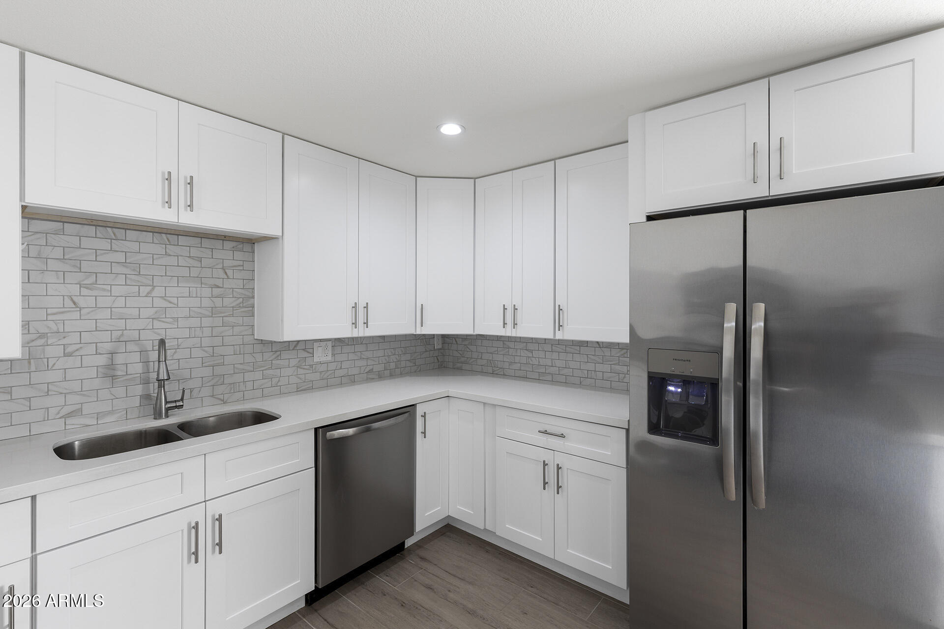 3749 East Pershing Avenue Phoenix, AZ 85032 - Photo 27 of 53 a kitchen with white cabinets and white appliances