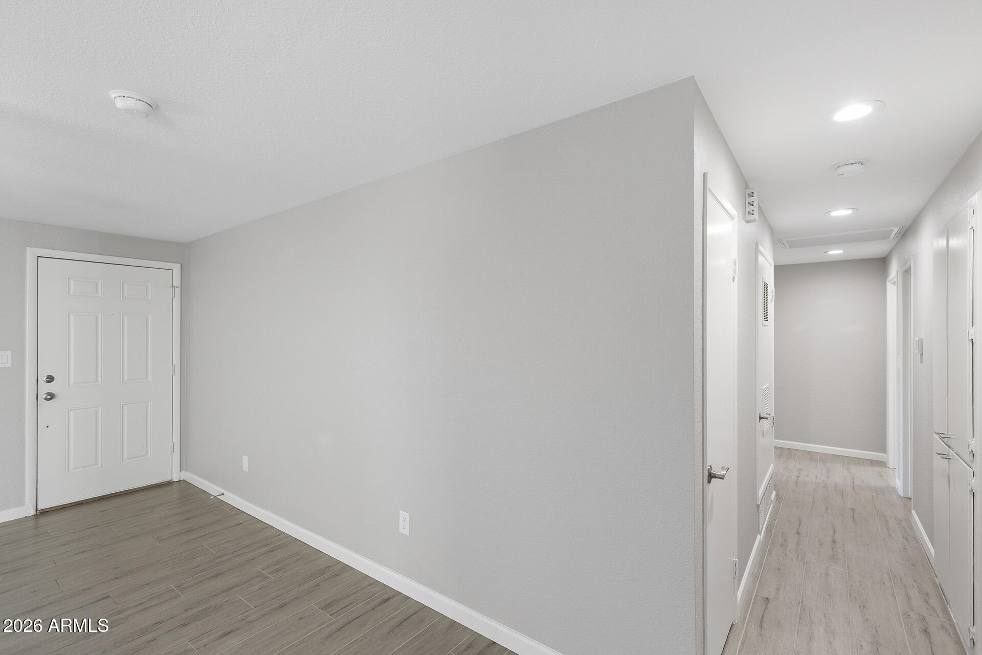 3749 East Pershing Avenue Phoenix, AZ 85032 - Photo 28 of 53 a view of a hallway with wooden floor