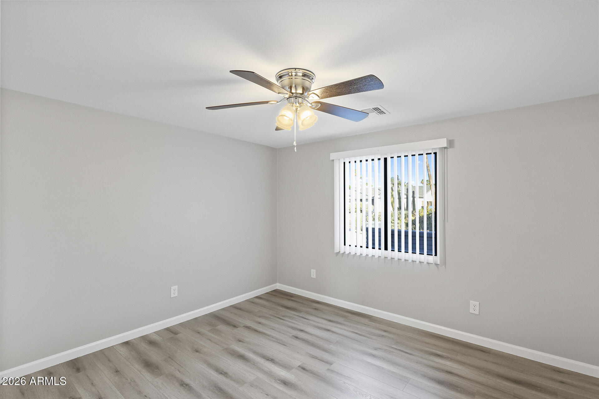 3749 East Pershing Avenue Phoenix, AZ 85032 - Photo 29 of 53 a view of an empty room with window and a fan