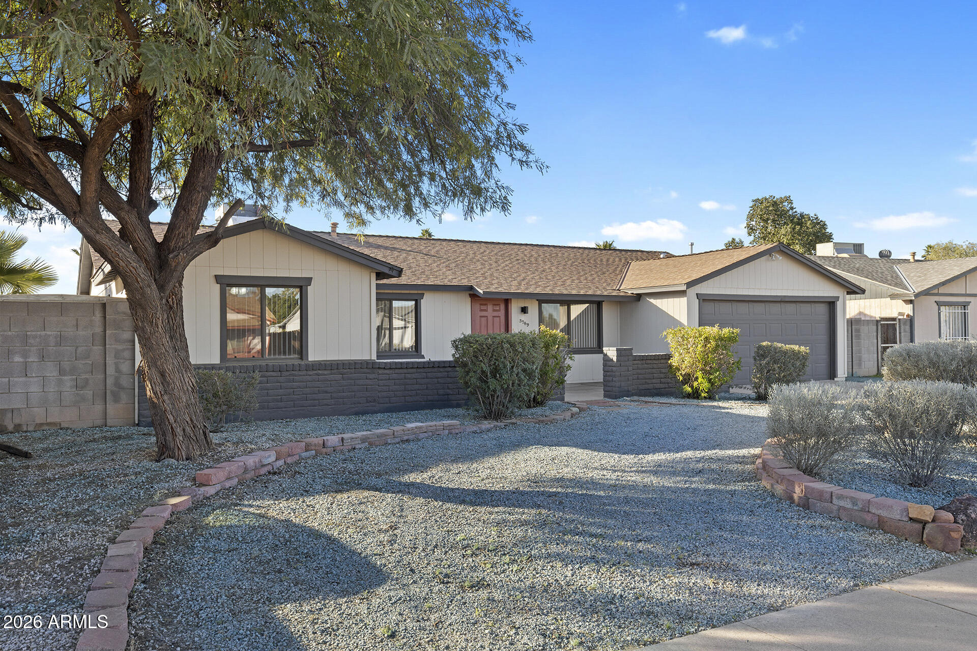 3749 East Pershing Avenue Phoenix, AZ 85032 - Photo 2 of 53 a front view of a house with a yard and garage