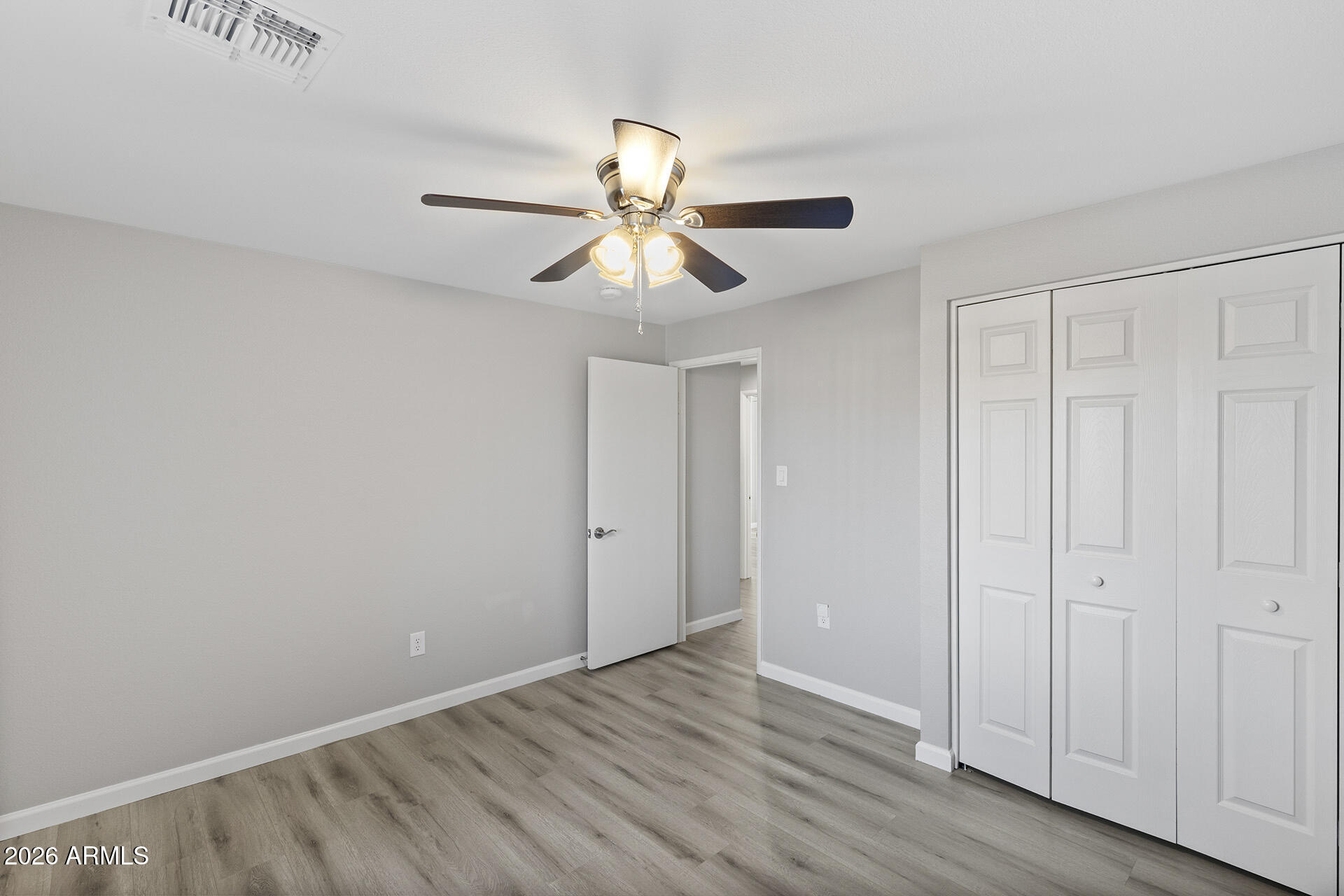 3749 East Pershing Avenue Phoenix, AZ 85032 - Photo 30 of 53 a view of a room with wooden floor