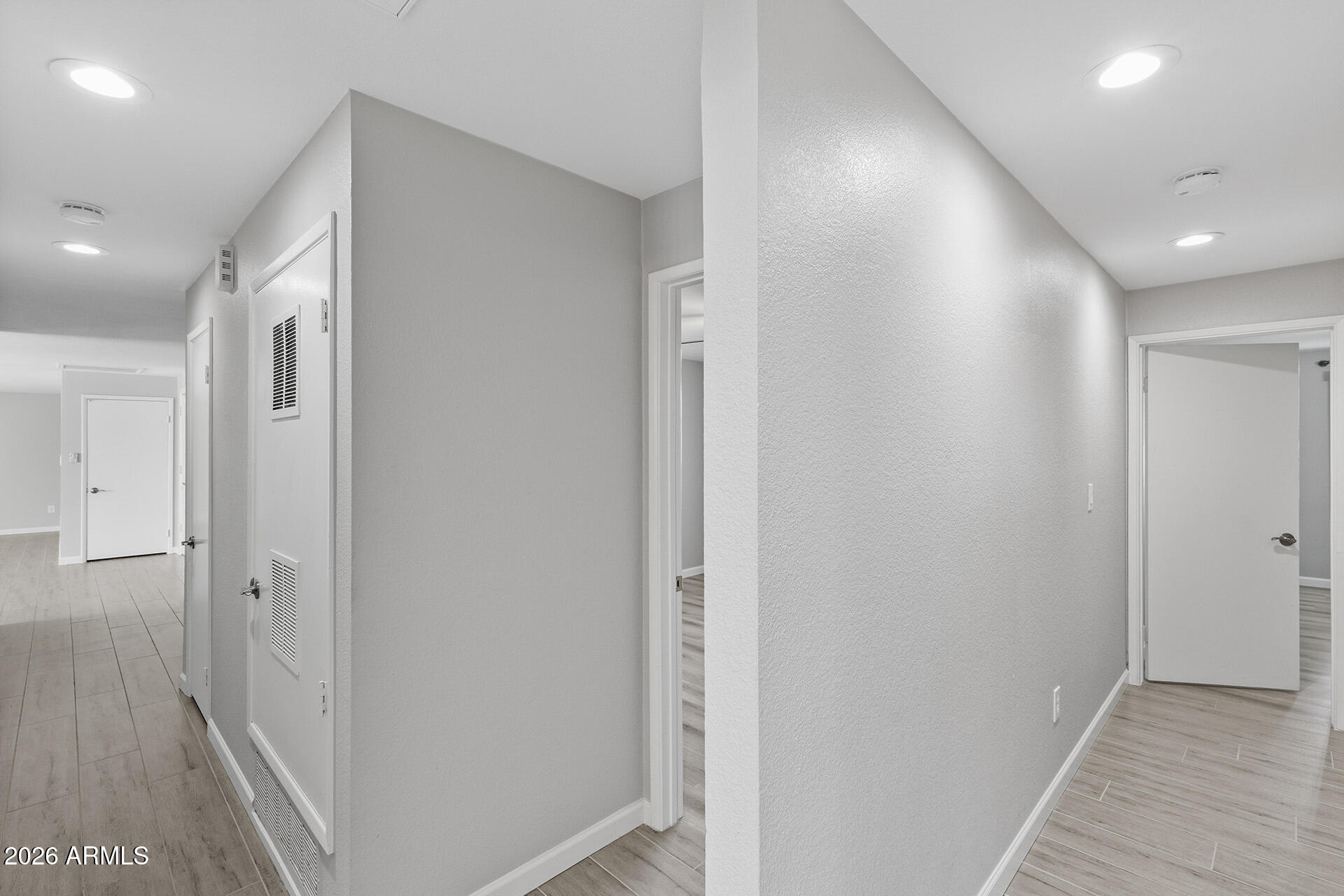 3749 East Pershing Avenue Phoenix, AZ 85032 - Photo 36 of 53 a view of a hallway with wooden floor