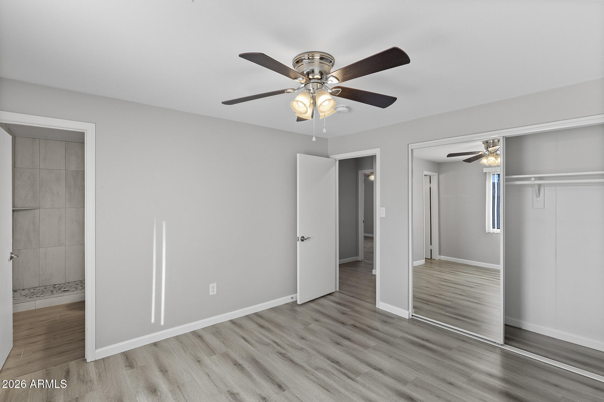 3749 East Pershing Avenue Phoenix, AZ 85032 - Photo 38 of 53 a view of an empty room and wooden floor