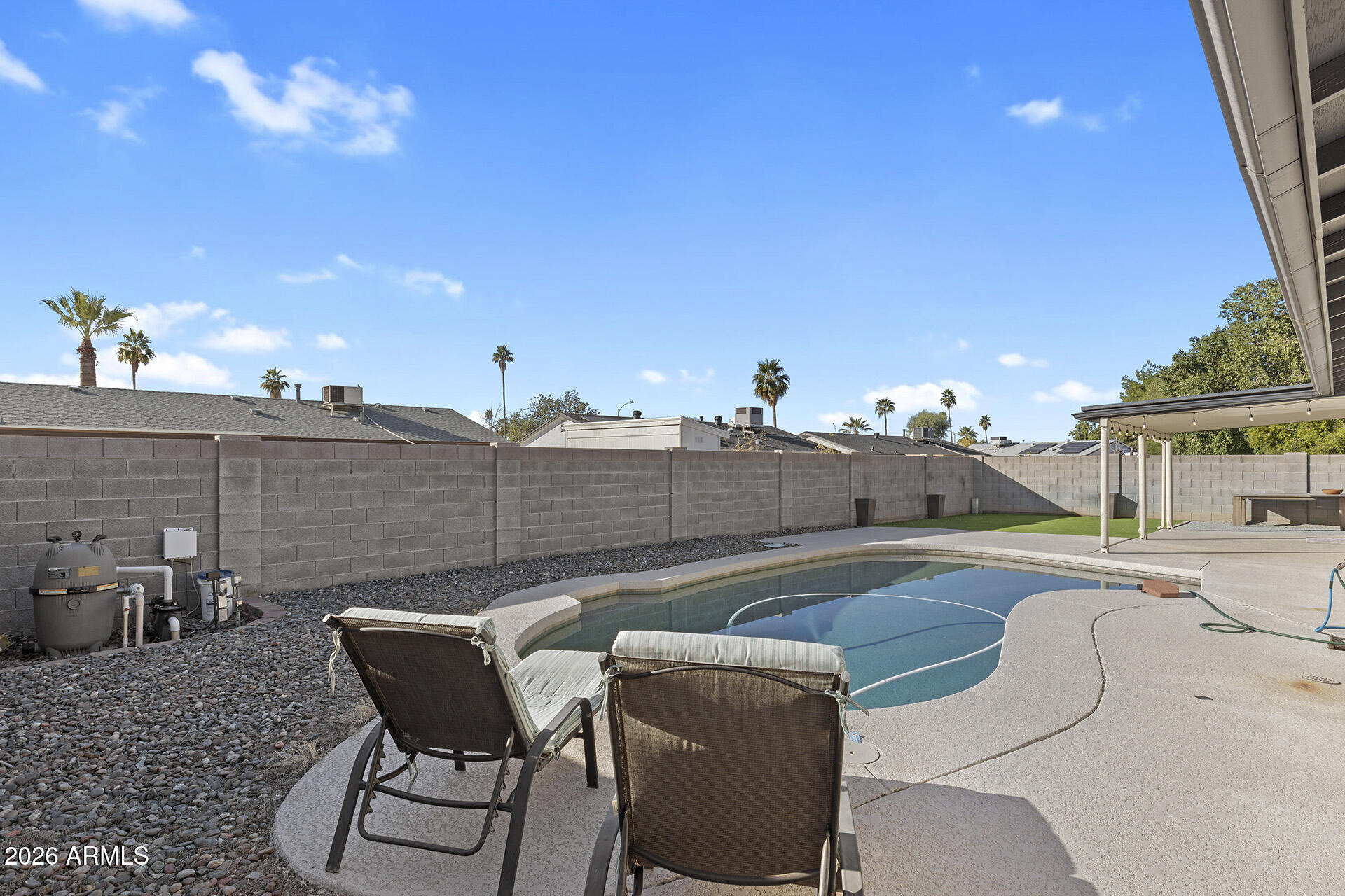 3749 East Pershing Avenue Phoenix, AZ 85032 - Photo 40 of 53 a view of a patio with table and chairs and potted plants
