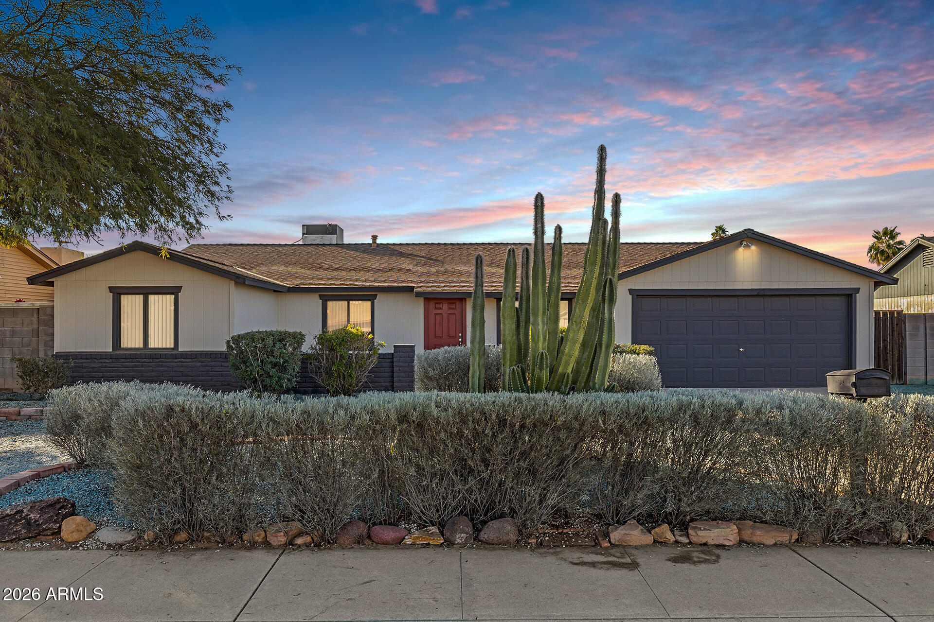 3749 East Pershing Avenue Phoenix, AZ 85032 - Photo 46 of 53 a front view of a house with a yard