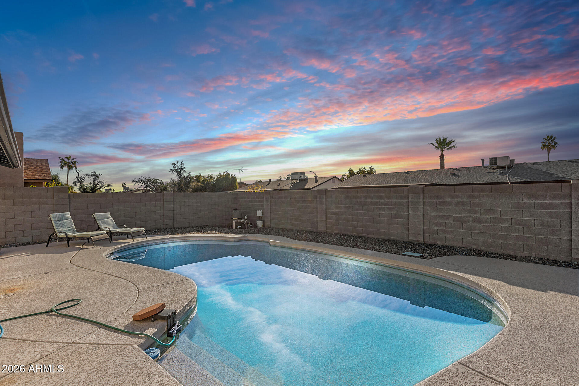 3749 East Pershing Avenue Phoenix, AZ 85032 - Photo 51 of 53 a view of a swimming pool with an outdoor seating