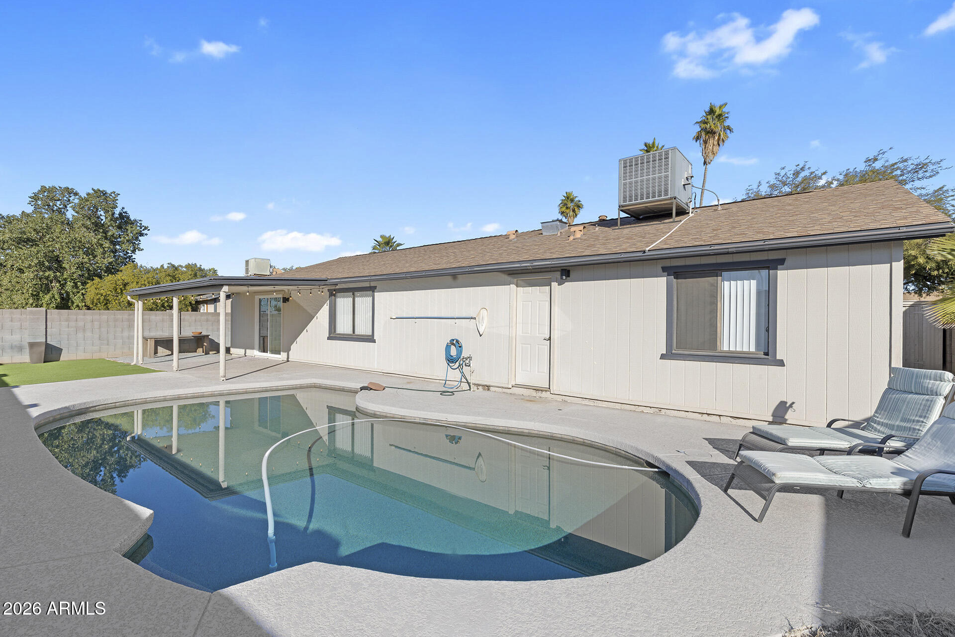 3749 East Pershing Avenue Phoenix, AZ 85032 - Photo 7 of 53 a view of a house with pool and chairs