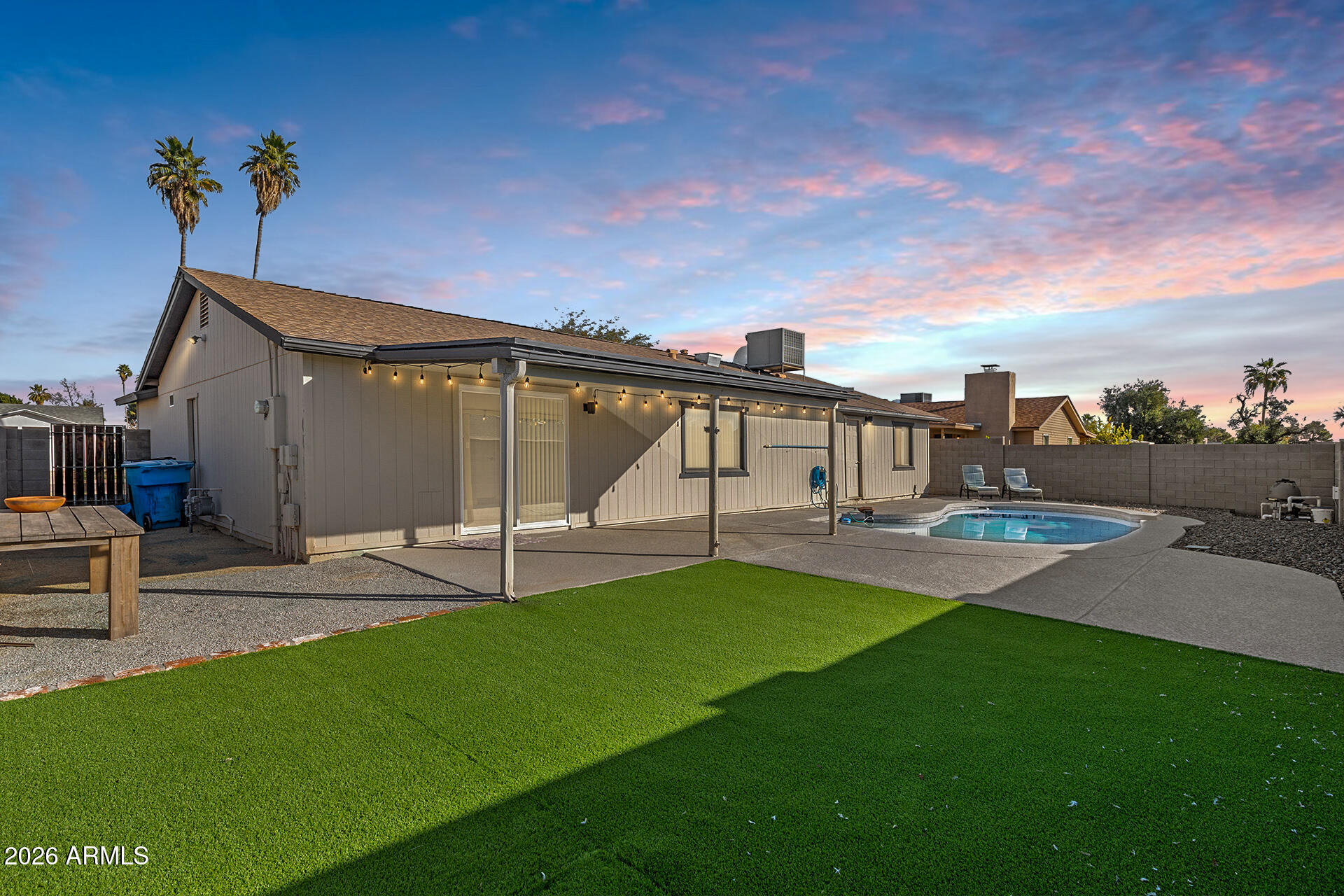 3749 East Pershing Avenue Phoenix, AZ 85032 - Photo 8 of 53 a view of a house with a yard and sitting area