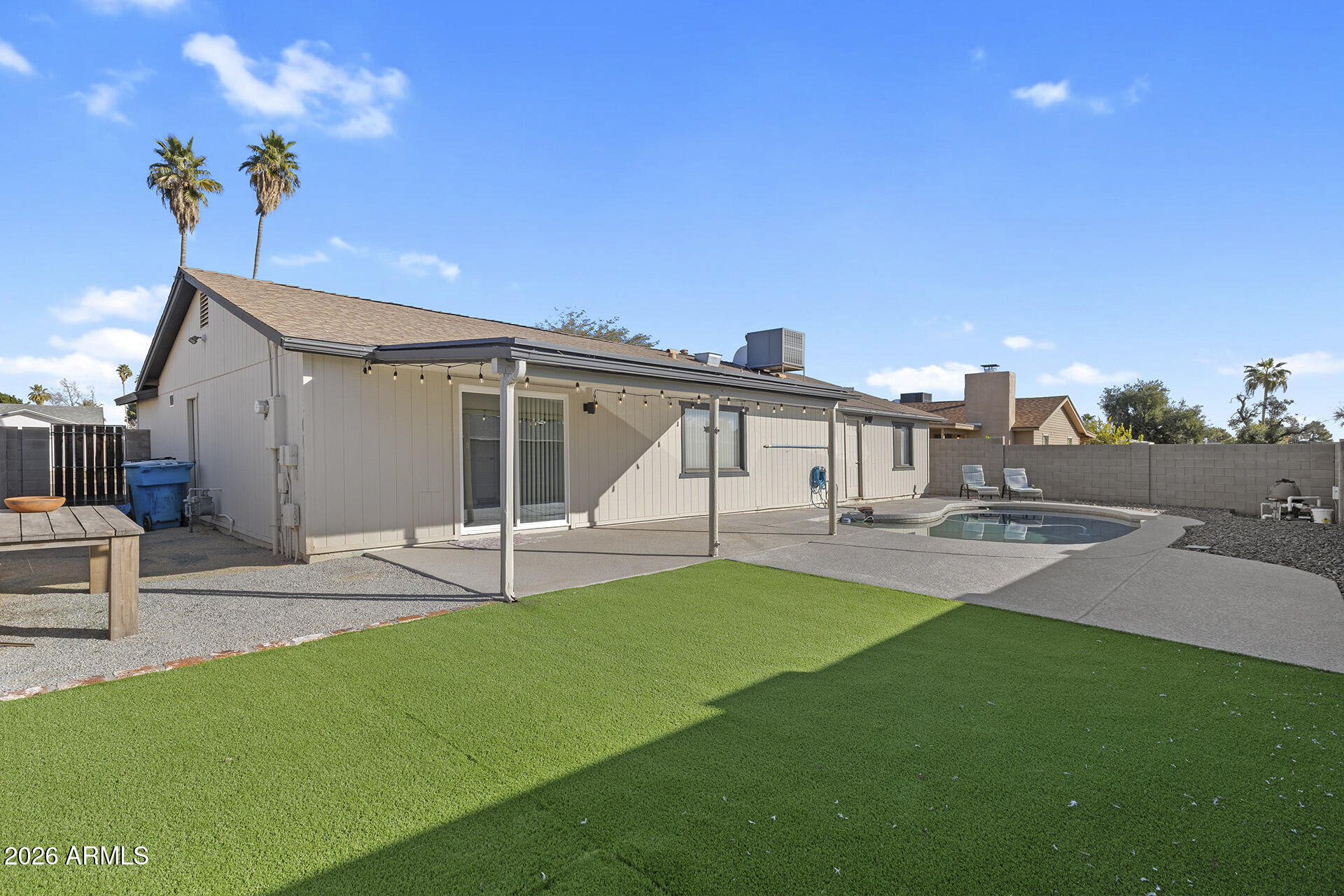 3749 East Pershing Avenue Phoenix, AZ 85032 - Photo 9 of 53 a view of a house with a backyard and a tree