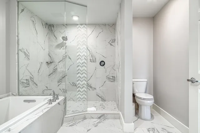 a bathroom with double vanity sinks and a mirror