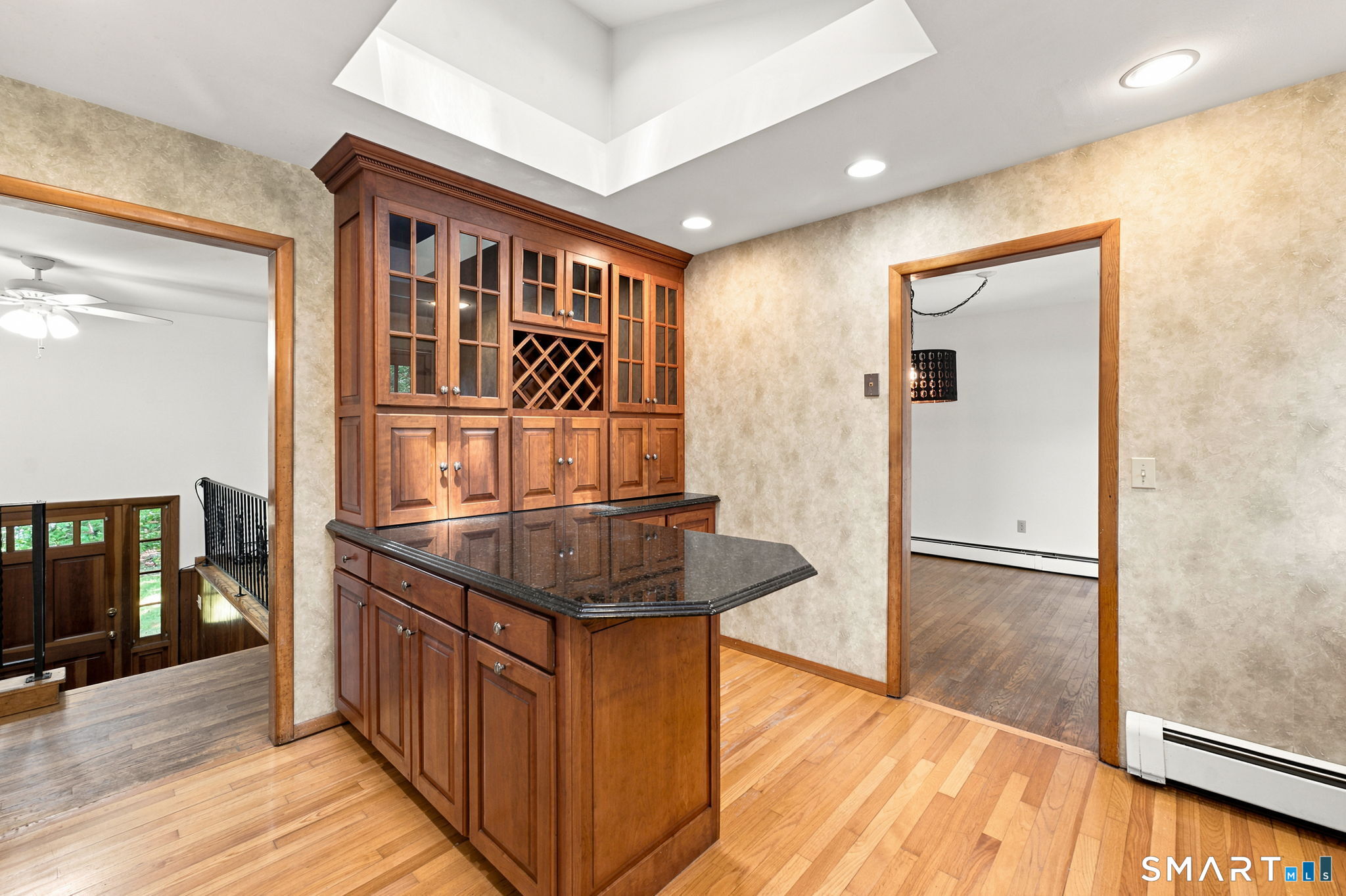 448 Mixville Road Cheshire, CT 06410 - Photo 12 of 32 a view of a hallway with wooden floor and furniture
