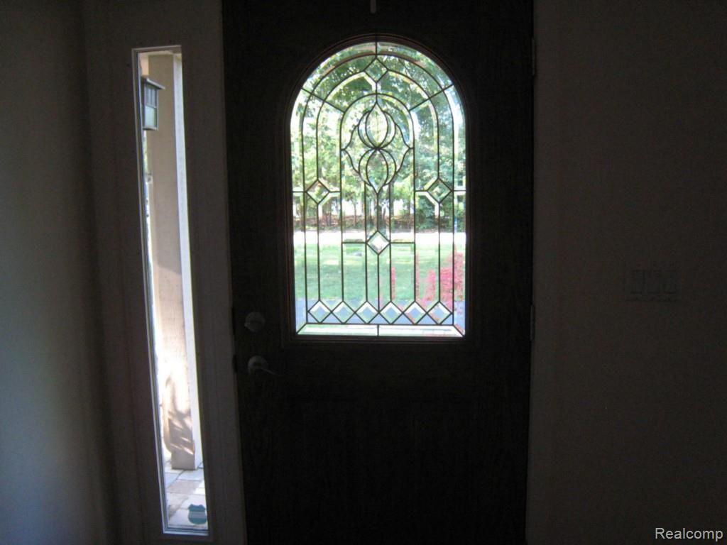 8568 Rucker Road Grosse Ile, MI 48138 - Photo 9 of 24 Leaded glass door in entrance way