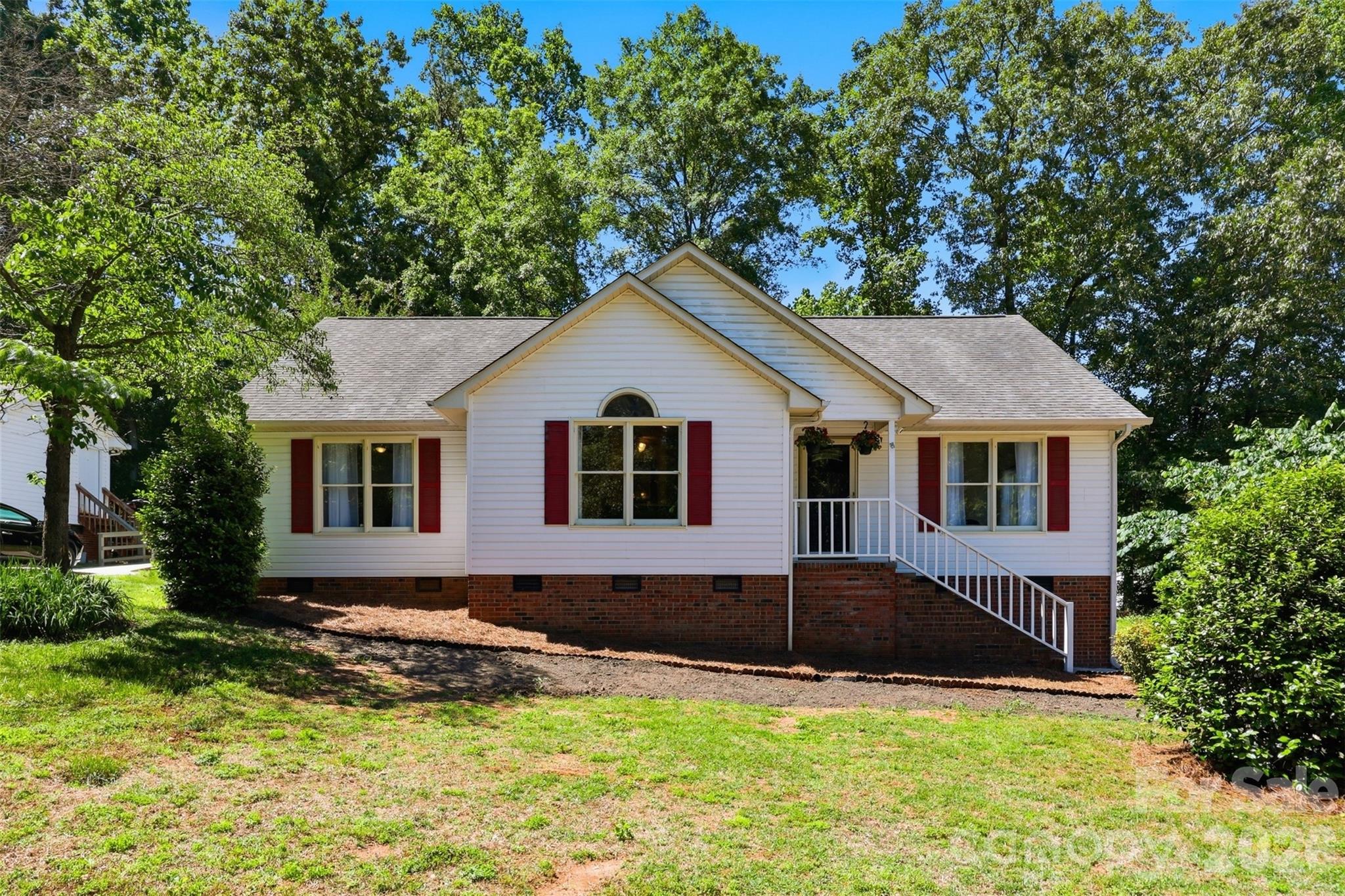 913 Pleasant Ridge Road Fort Mill, SC 29715 - Photo 1 of 40 a front view of a house with a yard