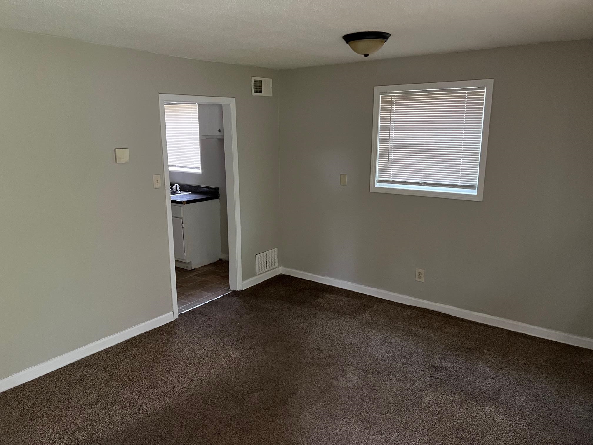 2457 Dwight Road Memphis, TN 38114 - Photo 2 of 8 an empty room with windows