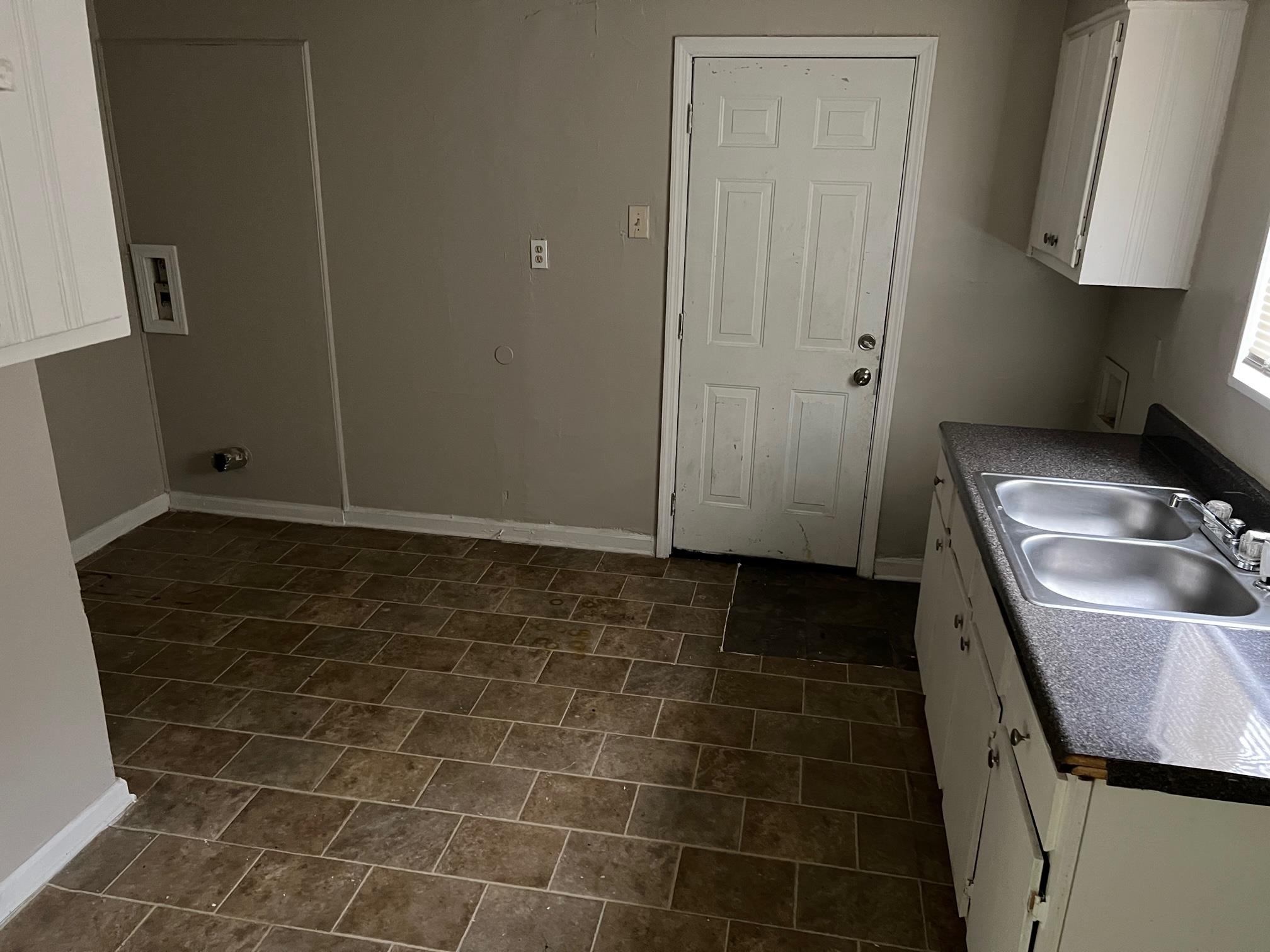 2457 Dwight Road Memphis, TN 38114 - Photo 3 of 8 a bathroom with a sink a toilet and a mirror