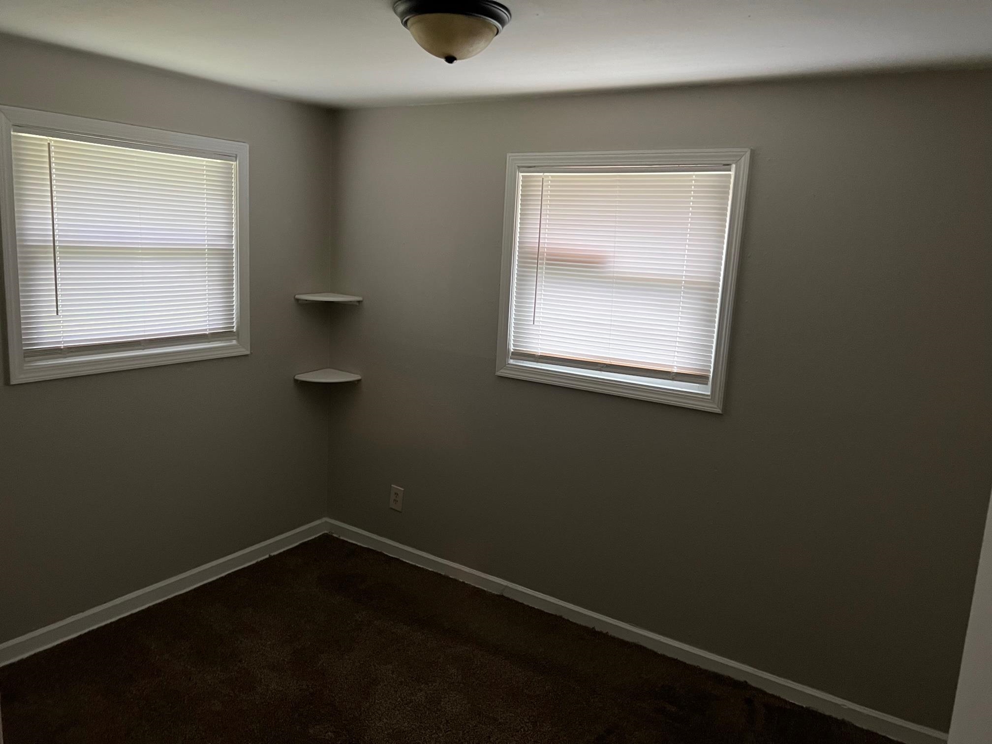 2457 Dwight Road Memphis, TN 38114 - Photo 8 of 8 an empty room with a window