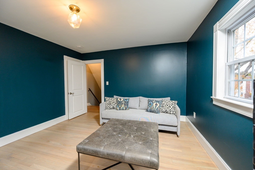 651 Canton Avenue Milton, MA 02186 - Photo 20 of 42 a living room with furniture and a window