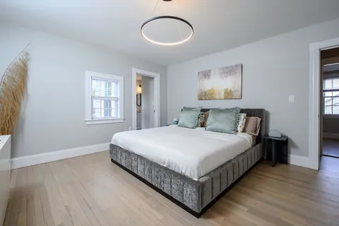 a bedroom with a bed and window