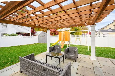 a view of yard with patio