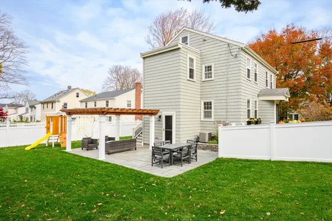 a view of backyard with a garden and bench