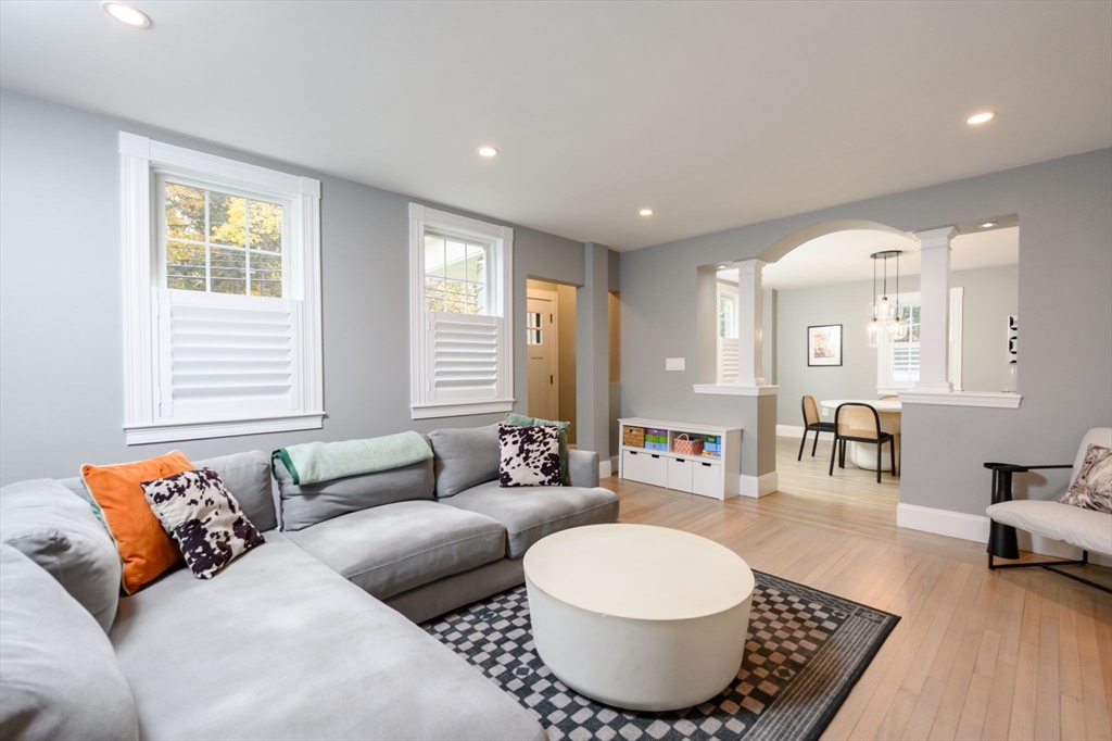 651 Canton Avenue Milton, MA 02186 - Photo 8 of 42 a living room with furniture a wooden floor and a large window