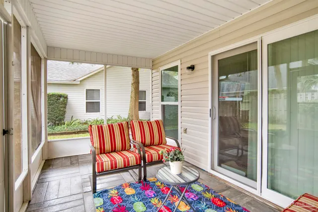 a balcony with furniture and window