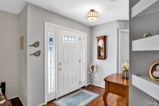 a view of a livingroom with furniture and windows