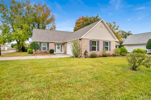 a view of a house with pool and chairs