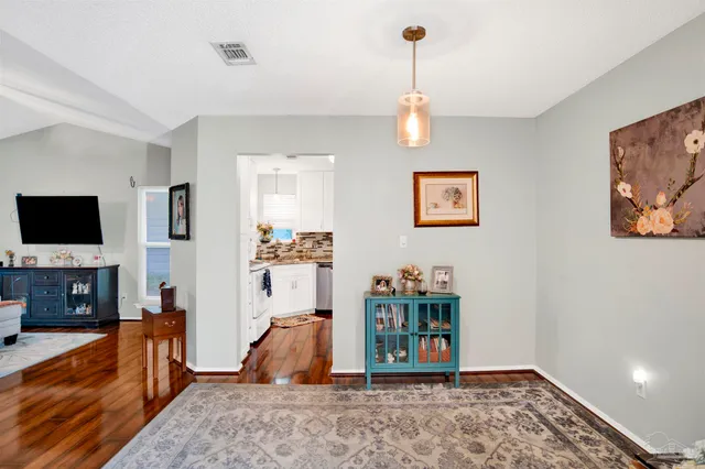 a view of livingroom with furniture and flat screen tv