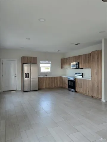 a view of a big room with windows and cabinet