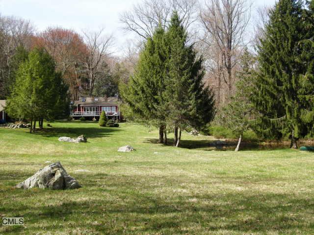 201 Oscaleta Road Ridgefield, CT 06877 - Photo 1 of 1 a backyard of a house with lots of green space
