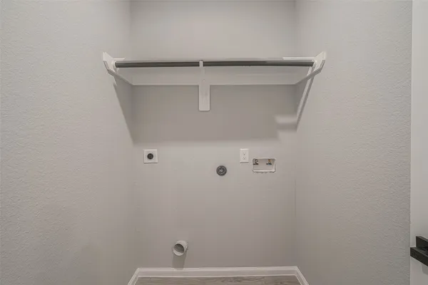 a spacious bedroom with a bed and a dresser