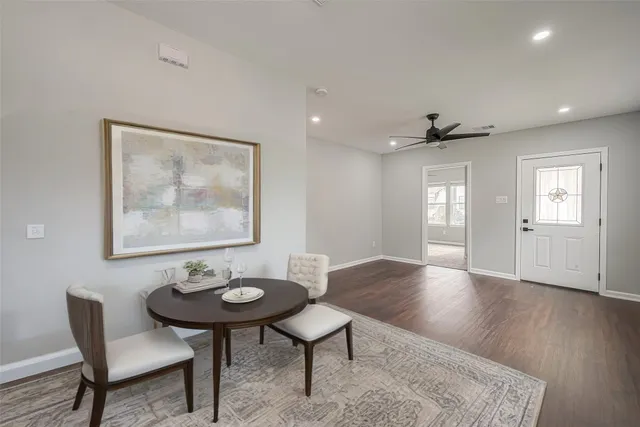 a view of a livingroom with furniture window and wooden floor