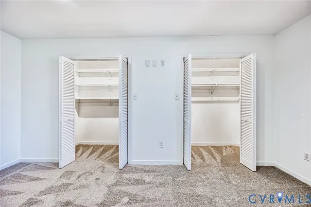 a view of an empty room and bedroom