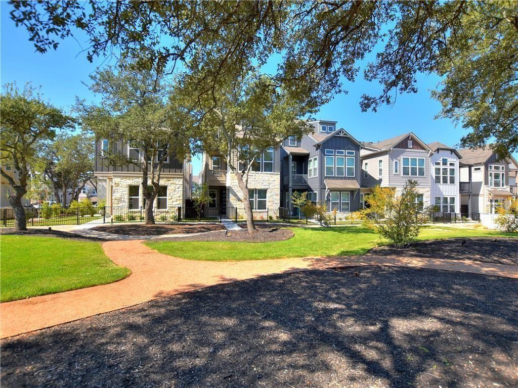 13611 Terrett Trace, Unit 108 Austin, TX 78717 - Photo 2 of 33 a view of a house with a big yard and large trees